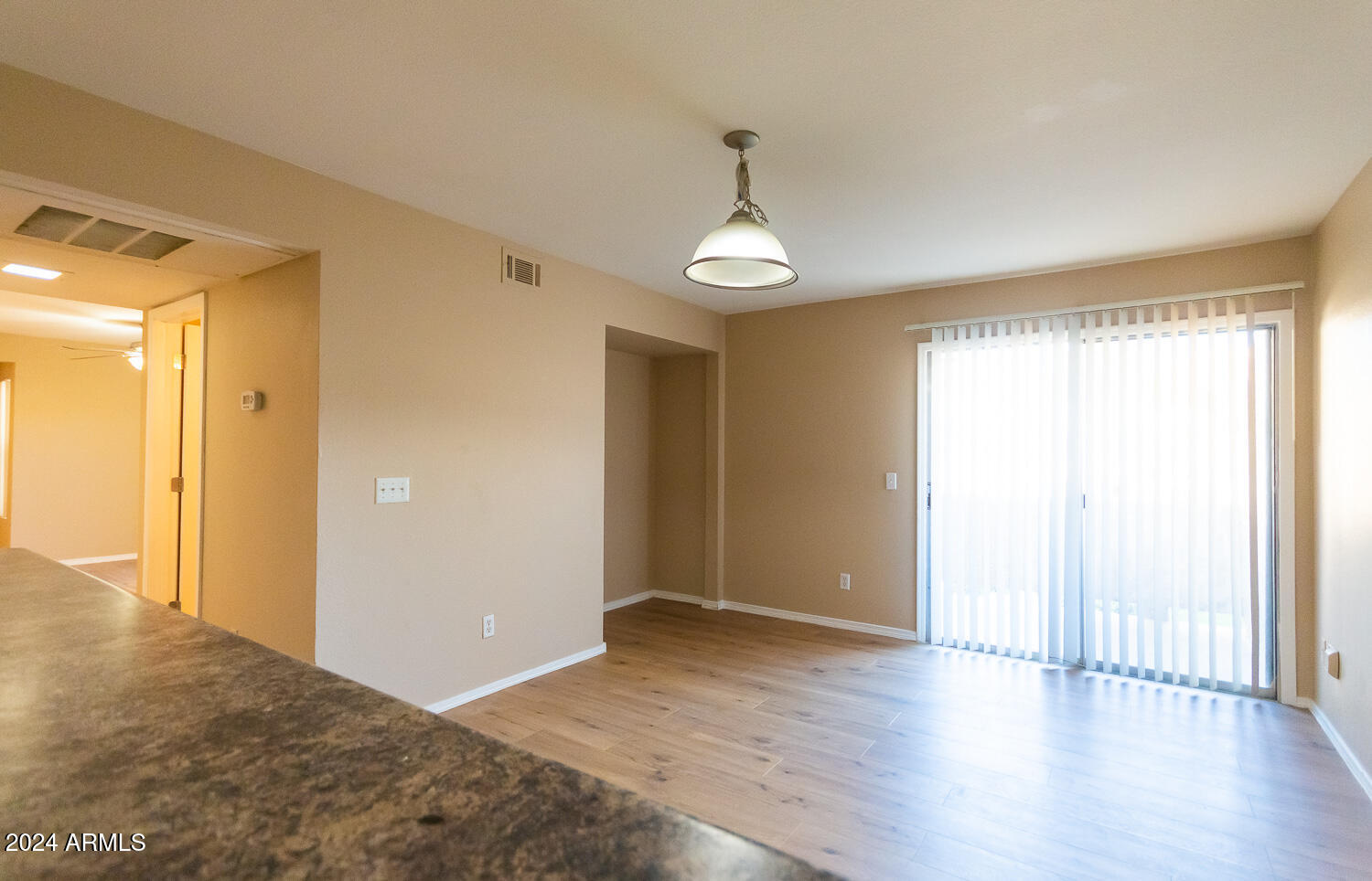 1331 West Baseline Road, Unit 253 Mesa, AZ 85202 - Photo 10 of 31 a view of livingroom with hardwood floor and a window