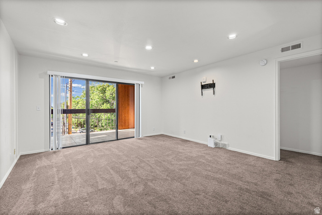 2244 North Canyon Road, Unit 212 Provo, UT 84604 - Photo 7 of 31 Recessed lighting and neutral carpeting complement the spacious room