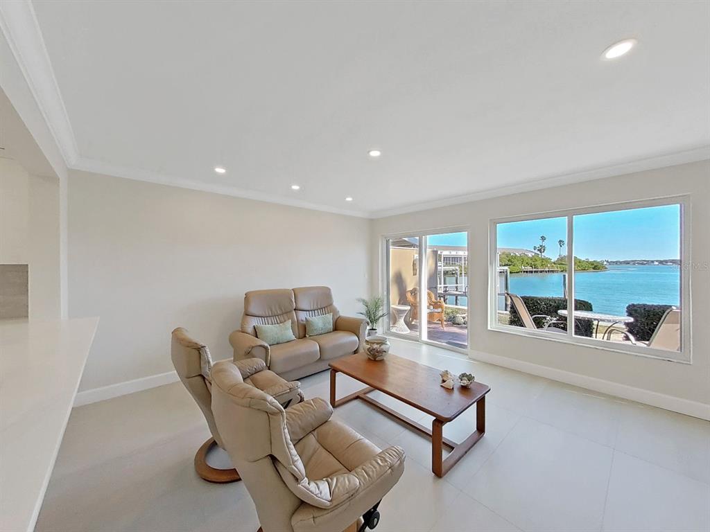 825 East Gulf Boulevard, Unit 110 Indian Rocks Beach, FL 33785 - Photo 19 of 75 a living room with furniture and a large window