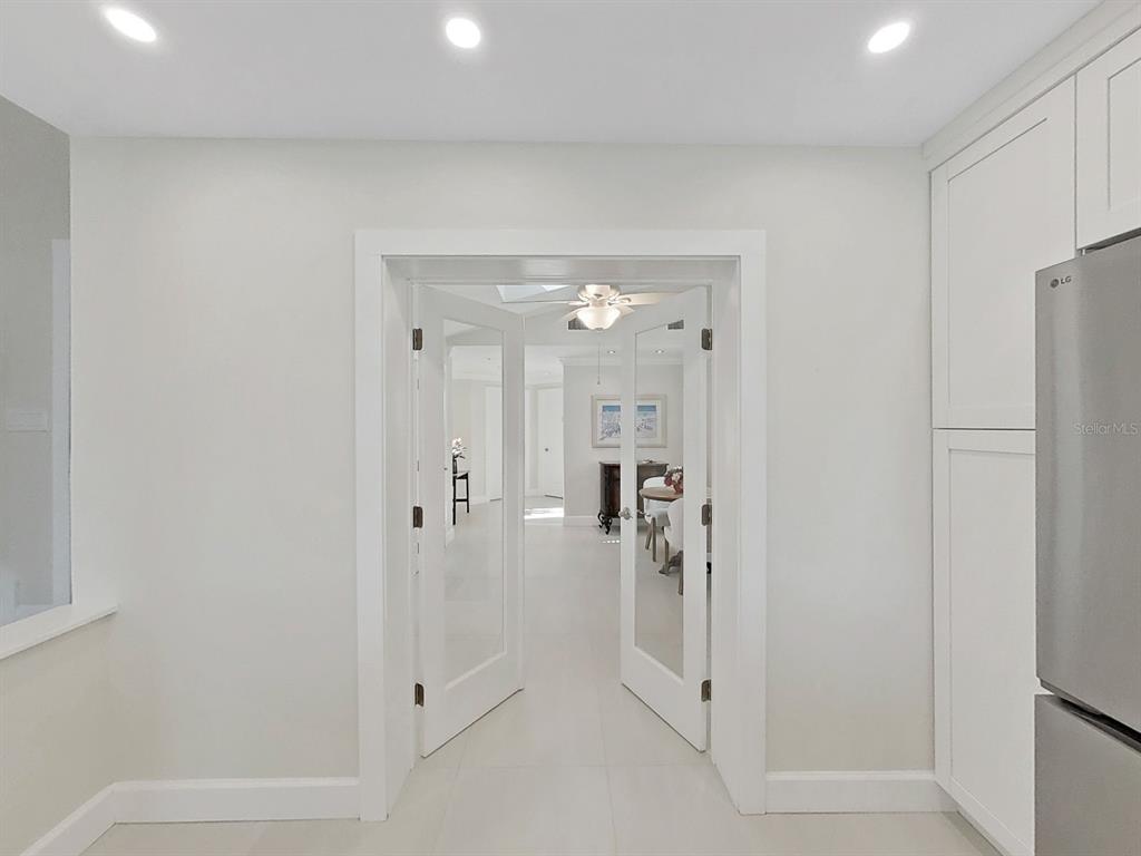 825 East Gulf Boulevard, Unit 110 Indian Rocks Beach, FL 33785 - Photo 22 of 75 a bathroom with a shower and a glass door