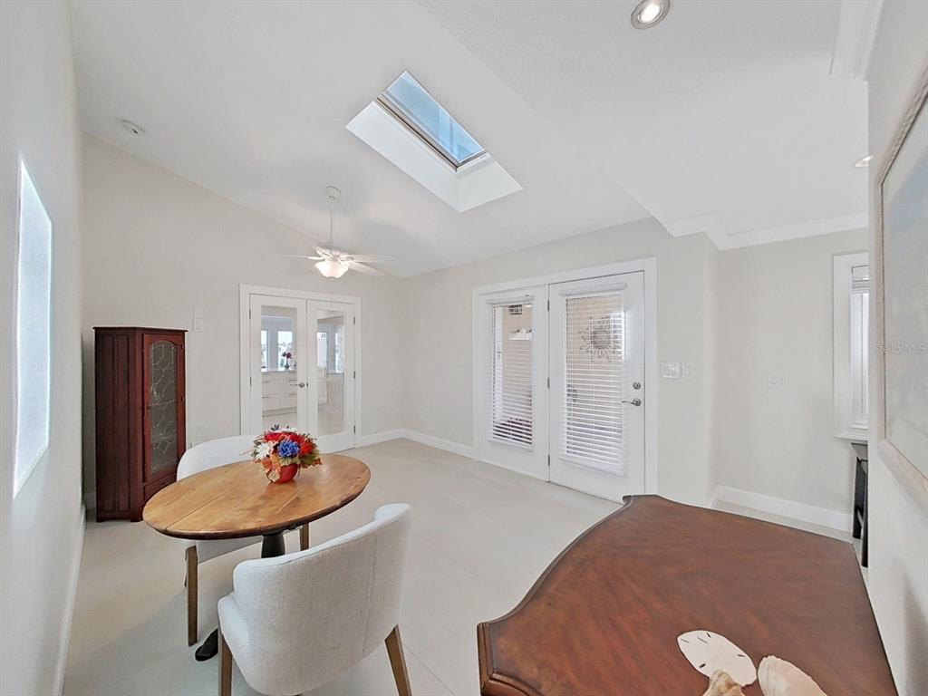 825 East Gulf Boulevard, Unit 110 Indian Rocks Beach, FL 33785 - Photo 24 of 75 a view of a room that has a table and a chair