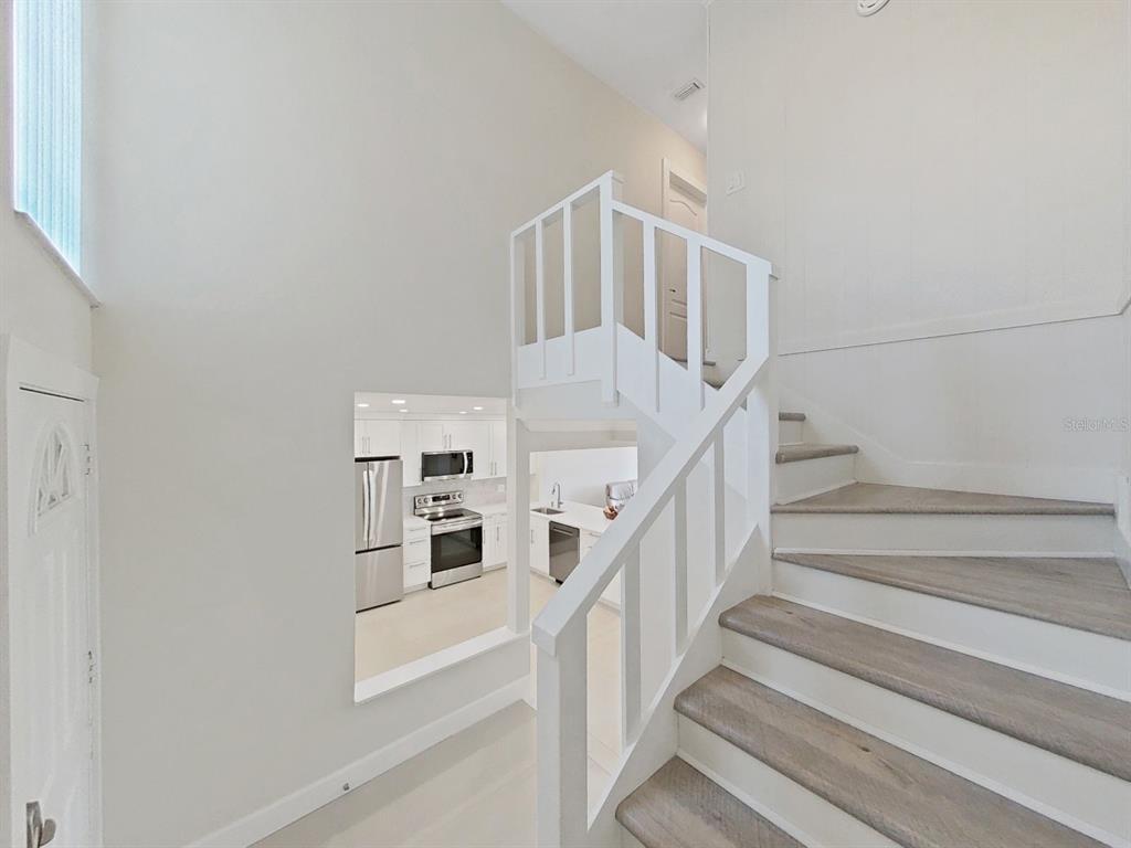 825 East Gulf Boulevard, Unit 110 Indian Rocks Beach, FL 33785 - Photo 33 of 75 a view of entryway and hall