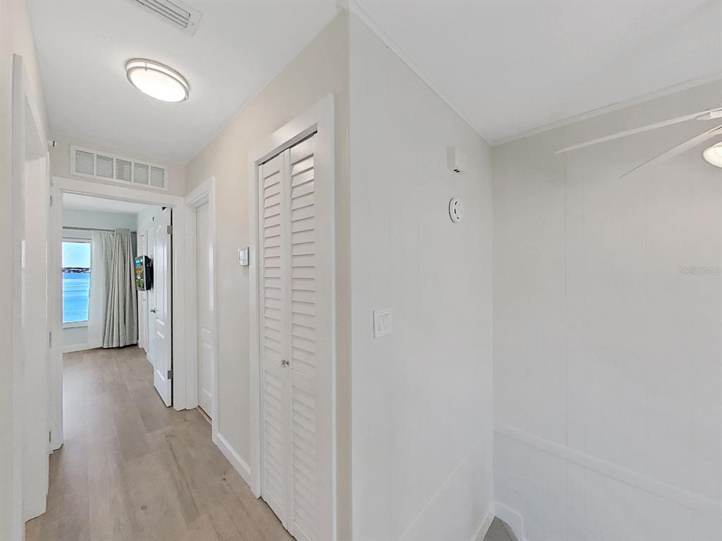 825 East Gulf Boulevard, Unit 110 Indian Rocks Beach, FL 33785 - Photo 34 of 75 a view of a bathroom with wooden floor