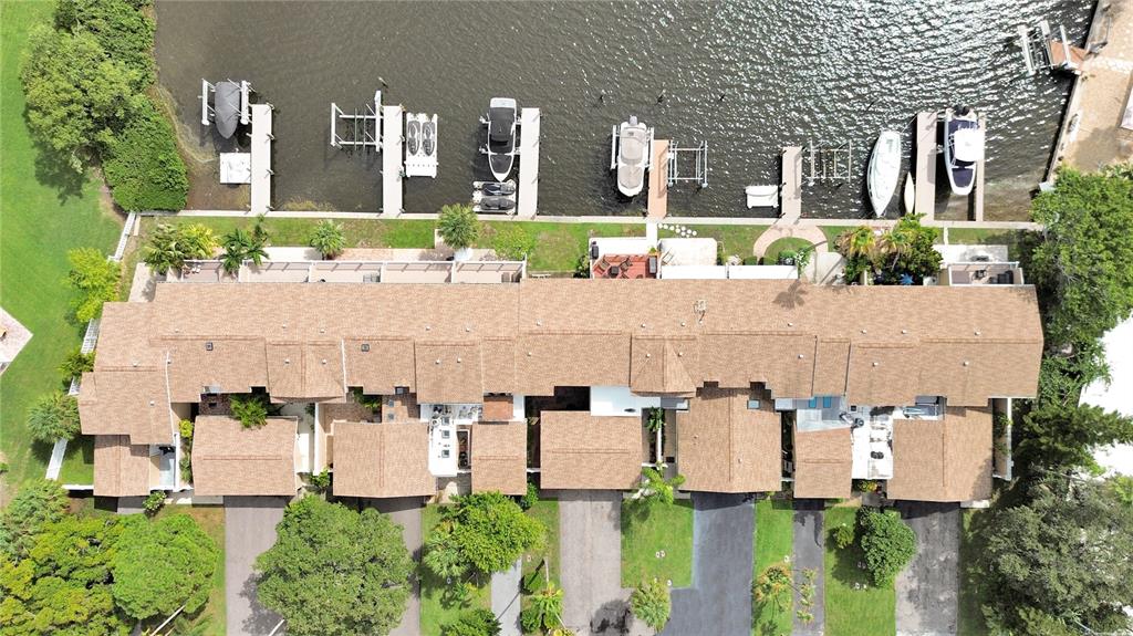 825 East Gulf Boulevard, Unit 110 Indian Rocks Beach, FL 33785 - Photo 54 of 75 an aerial view of multiple houses with a yard