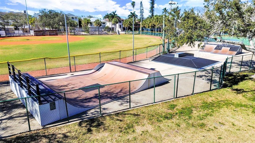 825 East Gulf Boulevard, Unit 110 Indian Rocks Beach, FL 33785 - Photo 63 of 75 a view of a swimming pool with a patio and a yard