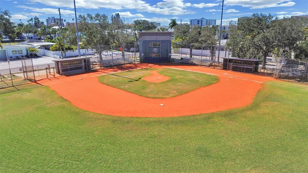 825 East Gulf Boulevard, Unit 110 Indian Rocks Beach, FL 33785 - Photo 64 of 75 a view of a swimming pool with a lounge chairs