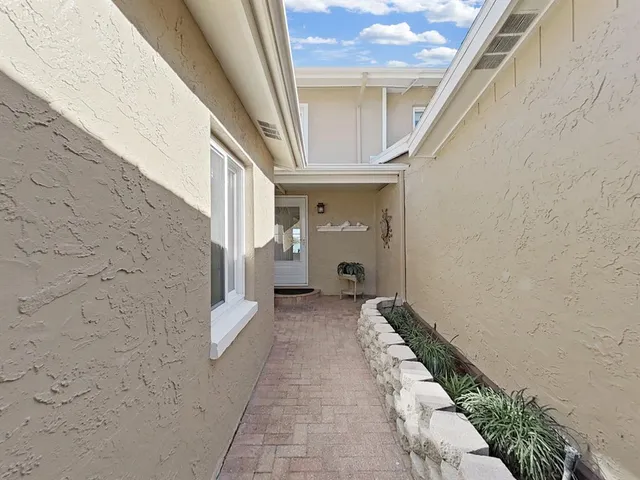 a kitchen with stainless steel appliances a refrigerator sink and stove