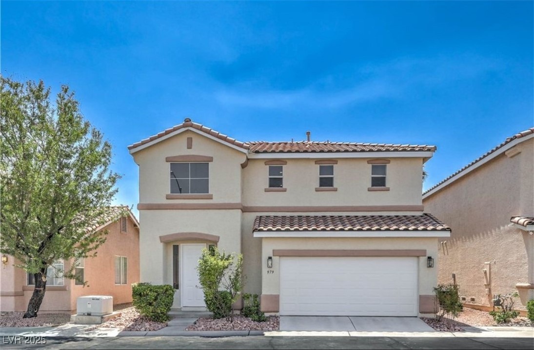 Mediterranean / spanish-style home featuring stucco siding, an attached garage, concrete driveway, and a tile roof