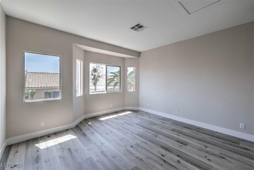 979 Park Bridge Avenue Las Vegas, NV 89123 - Photo 24 of 57 Unfurnished room with light wood finished floors and baseboards