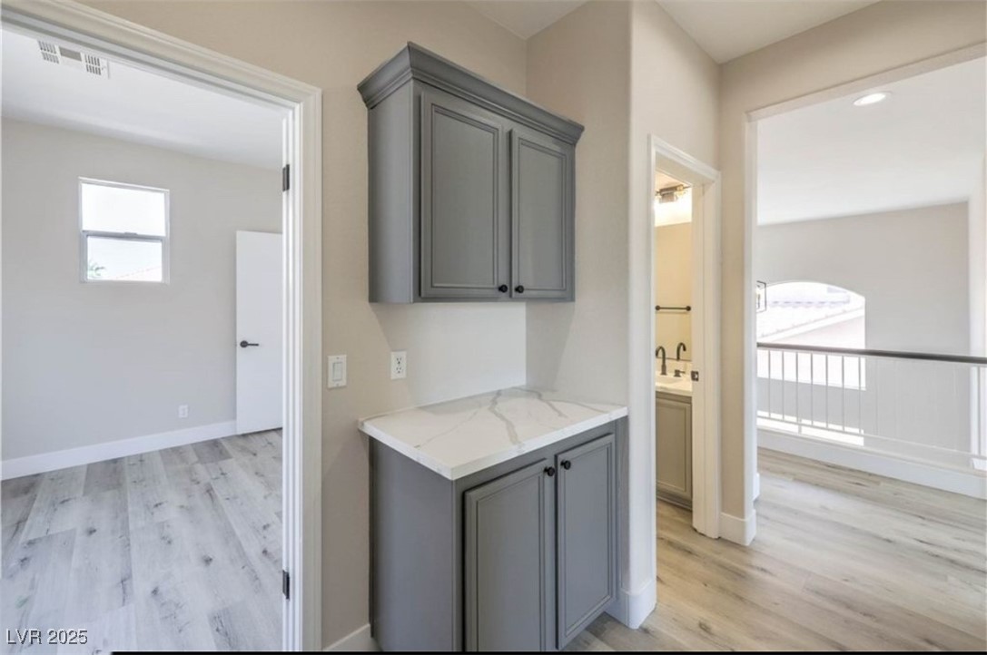 979 Park Bridge Avenue Las Vegas, NV 89123 - Photo 28 of 57 Hallway with light wood finished floors and baseboards