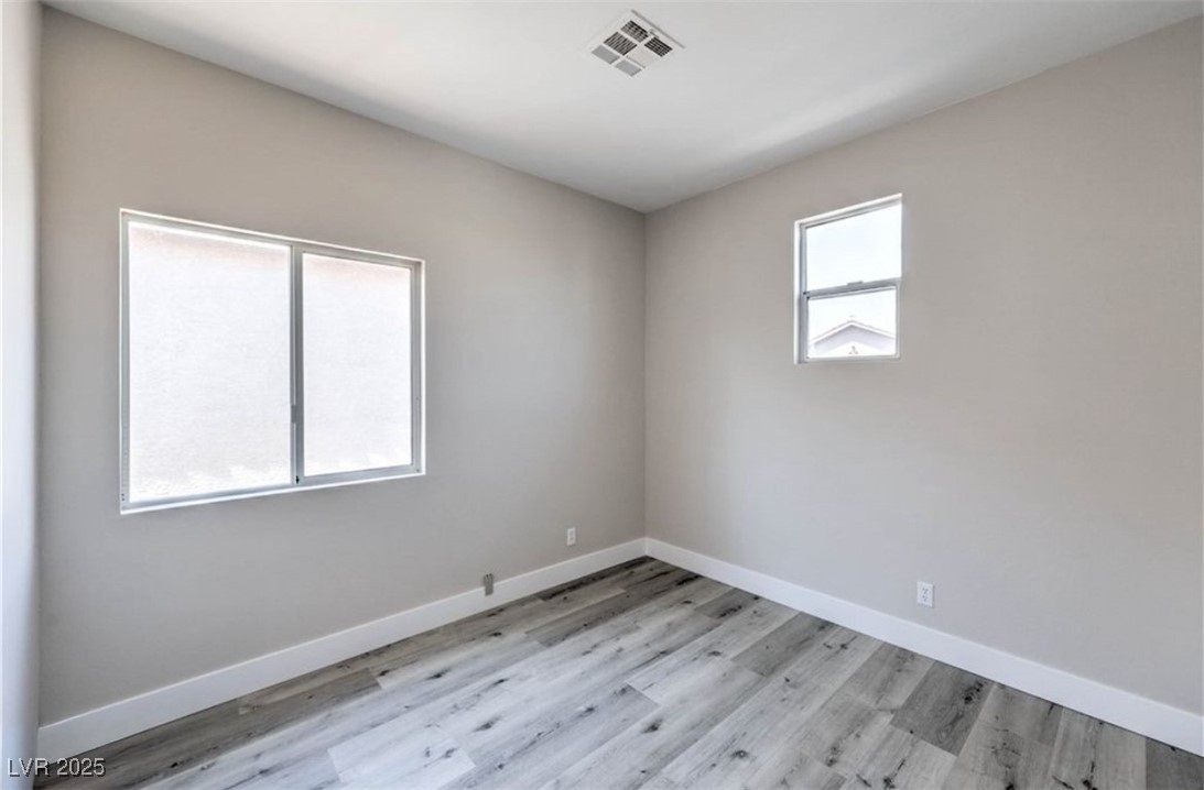 979 Park Bridge Avenue Las Vegas, NV 89123 - Photo 30 of 57 Unfurnished room featuring light wood-type flooring and baseboards