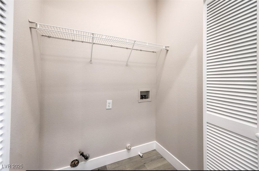 979 Park Bridge Avenue Las Vegas, NV 89123 - Photo 34 of 57 Laundry room with hookup for a gas dryer, washer hookup, and wood finished floors