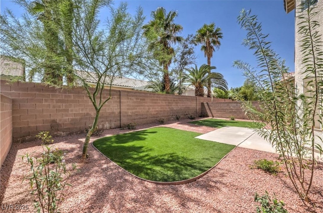 979 Park Bridge Avenue Las Vegas, NV 89123 - Photo 37 of 57 Fenced backyard with a patio