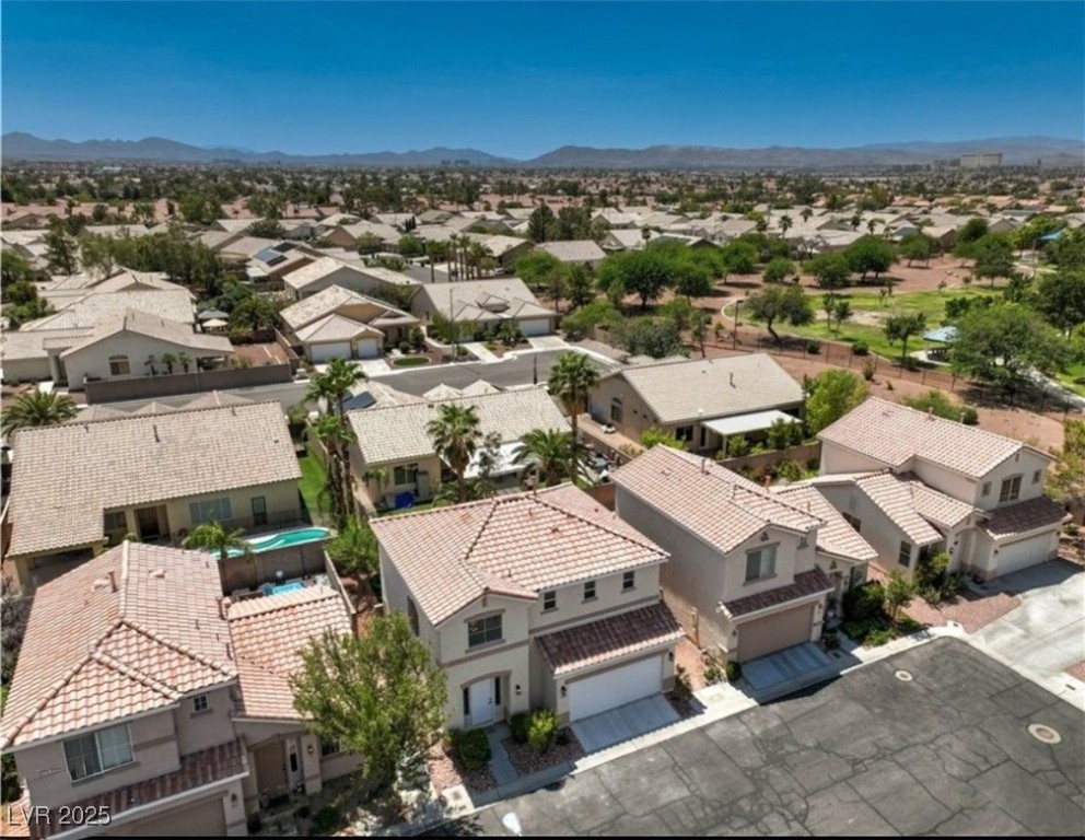 979 Park Bridge Avenue Las Vegas, NV 89123 - Photo 43 of 57 Aerial view of residential area with a mountainous background