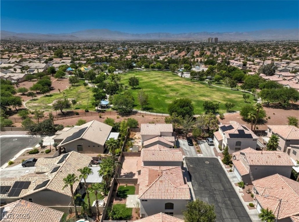 979 Park Bridge Avenue Las Vegas, NV 89123 - Photo 45 of 57 Aerial perspective of suburban area featuring a mountain backdrop