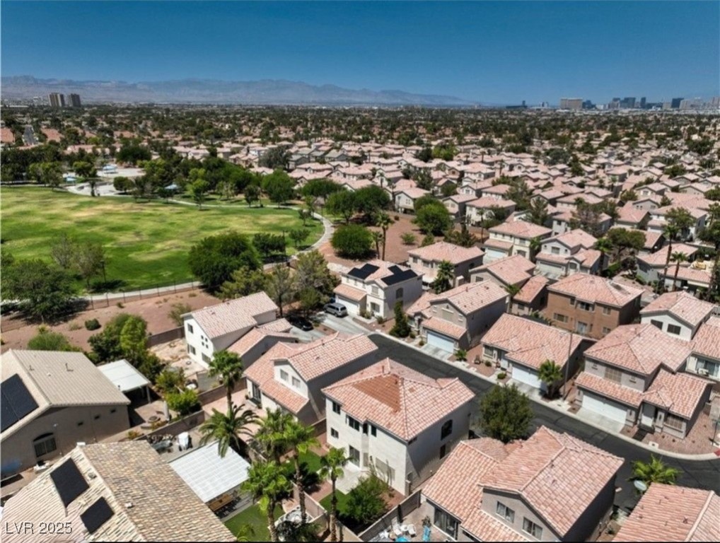 979 Park Bridge Avenue Las Vegas, NV 89123 - Photo 46 of 57 Aerial view of residential area with a mountainous background