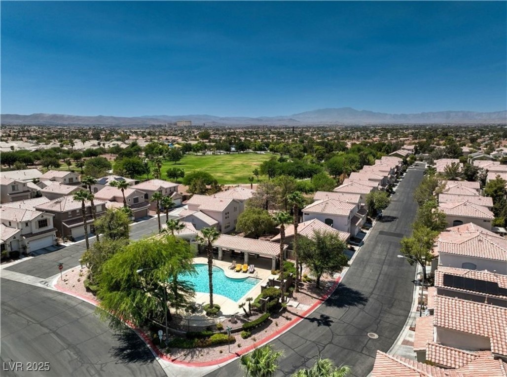 979 Park Bridge Avenue Las Vegas, NV 89123 - Photo 54 of 57 Aerial view of residential area featuring a pool and mountains
