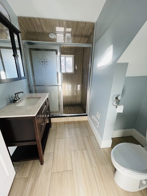 11 Hardwick Road Natick, MA 01760 - Photo 11 of 16 a spacious bathroom with a sink and a mirror