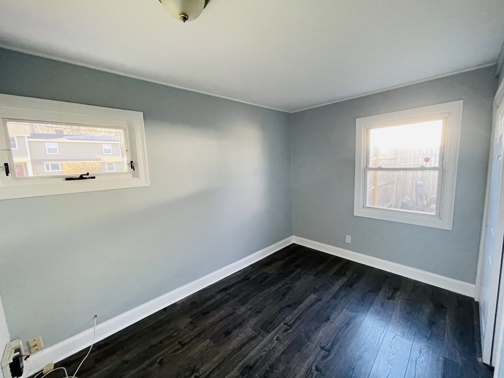 11 Hardwick Road Natick, MA 01760 - Photo 8 of 16 a view of a room with wooden floor and windows