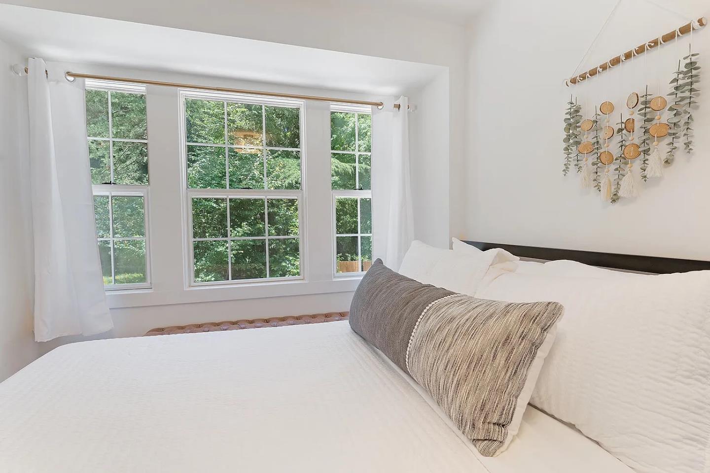 1003 Laurel Glen Road Soquel, CA 95073 - Photo 32 of 101 a bed sitting in a bedroom next to a window