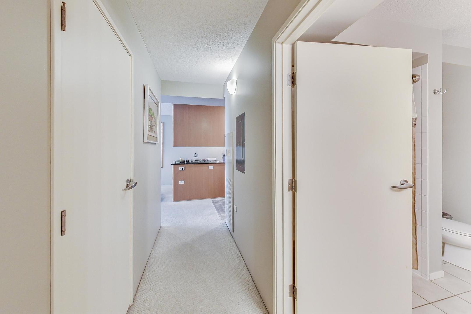 9655 Woods Drive, Unit 1405 Skokie, IL 60077 - Photo 15 of 36 a view of a room with a wardrobe space