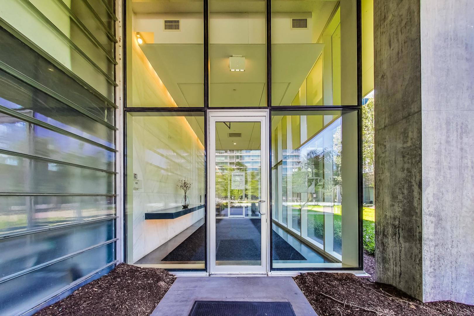 9655 Woods Drive, Unit 1405 Skokie, IL 60077 - Photo 2 of 36 a view of a glass door with a glass door