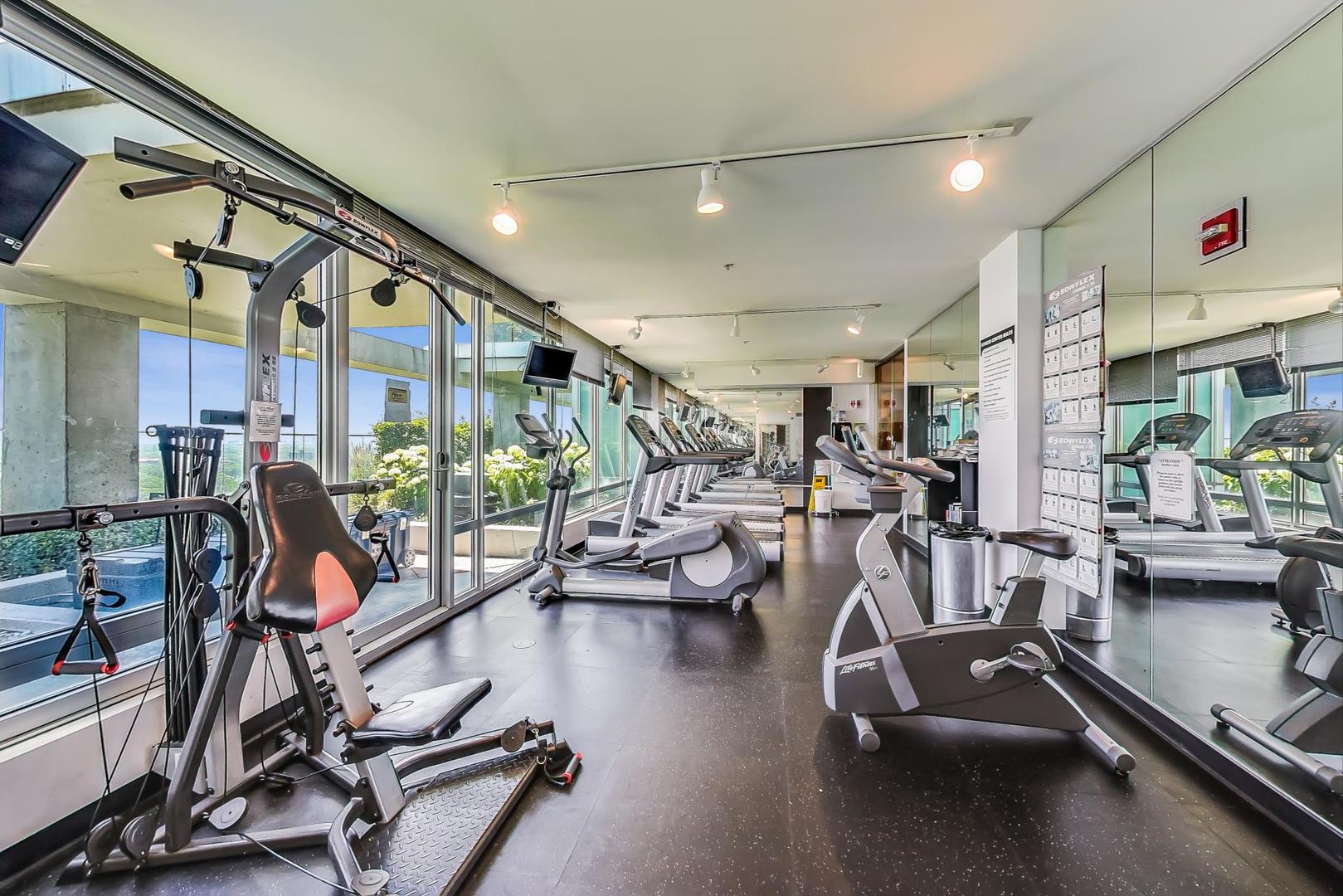 9655 Woods Drive, Unit 1405 Skokie, IL 60077 - Photo 28 of 36 a view of a room with gym equipment