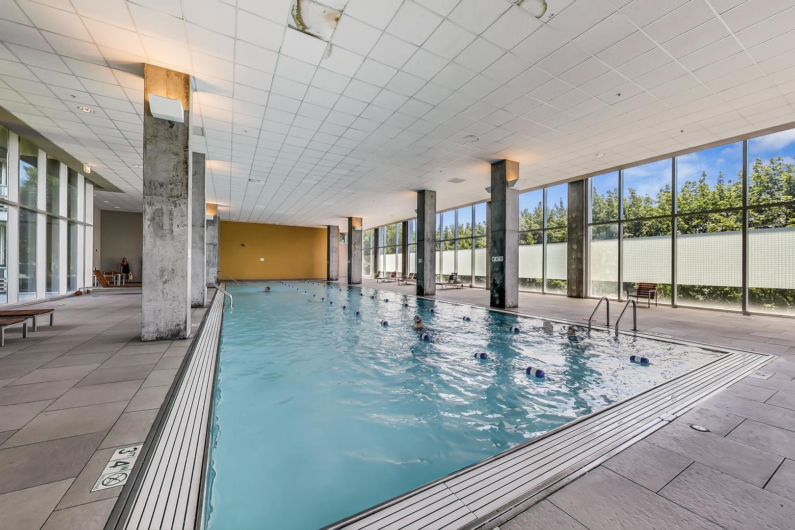 9655 Woods Drive, Unit 1405 Skokie, IL 60077 - Photo 31 of 36 a view of a living room and kitchen