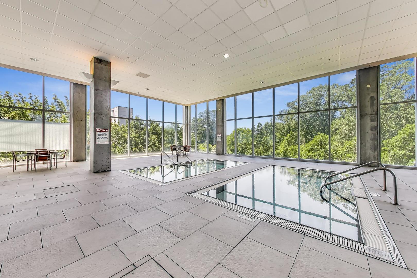 9655 Woods Drive, Unit 1405 Skokie, IL 60077 - Photo 33 of 36 a spacious bathroom with a large tub and shower