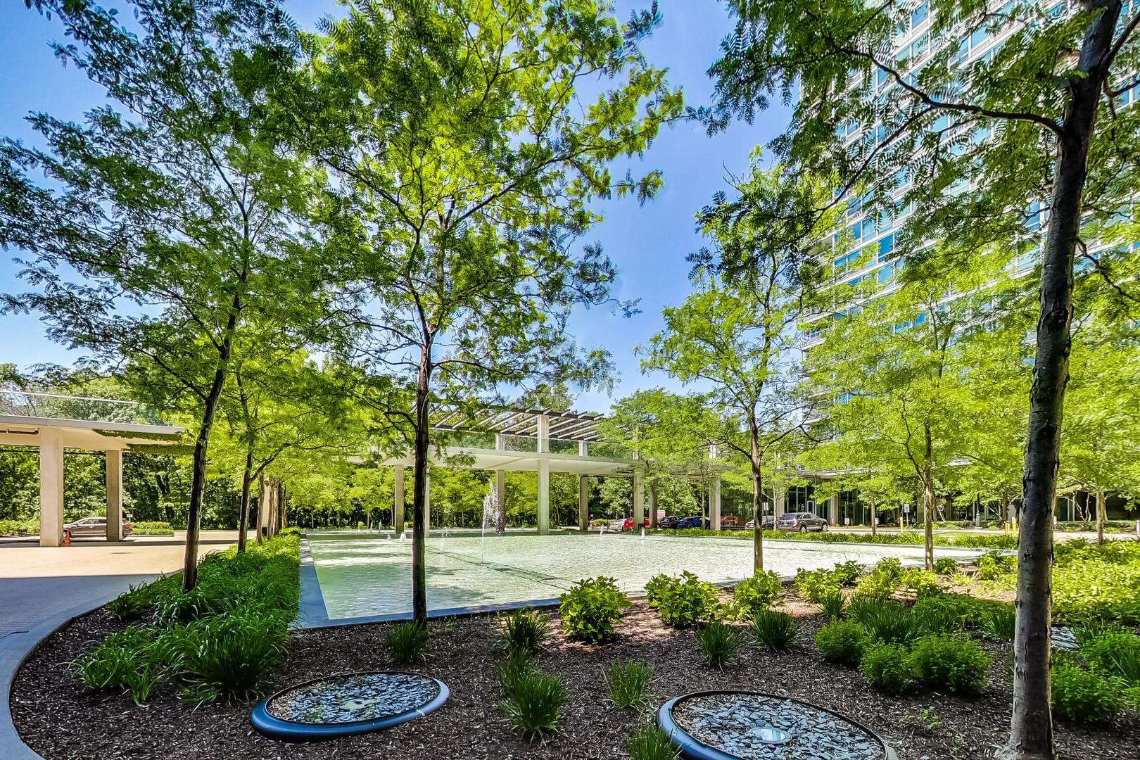 9655 Woods Drive, Unit 1405 Skokie, IL 60077 - Photo 36 of 36 a view of a garden with a slide