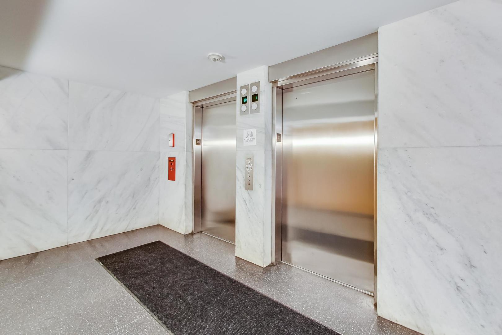 9655 Woods Drive, Unit 1405 Skokie, IL 60077 - Photo 6 of 36 a bathroom with a glass door shower