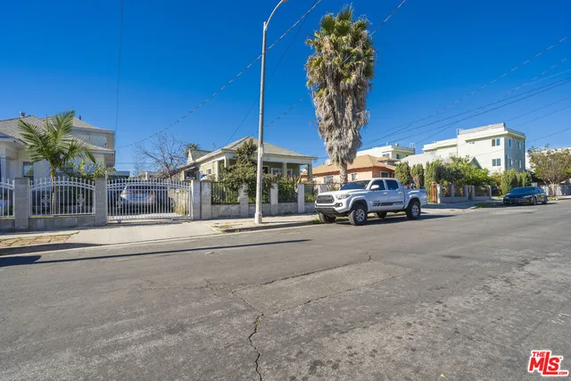 a view of a street with cars on road