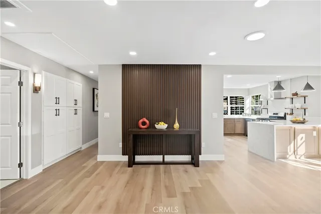 a view of kitchen with furniture and refrigerator