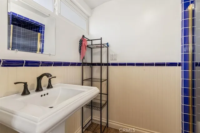 a view of a hallway with closet and cabinet