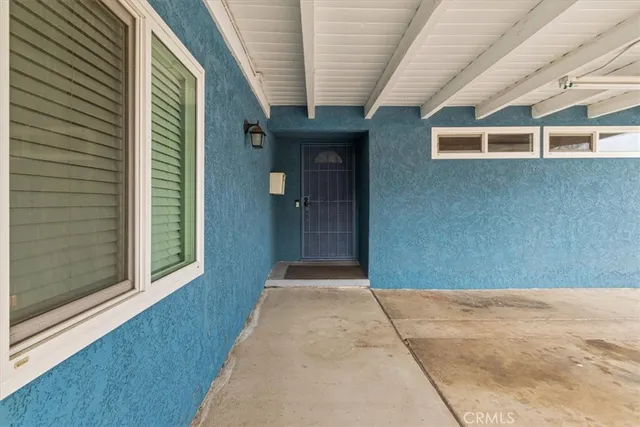 a living room with furniture wooden floor and a rug