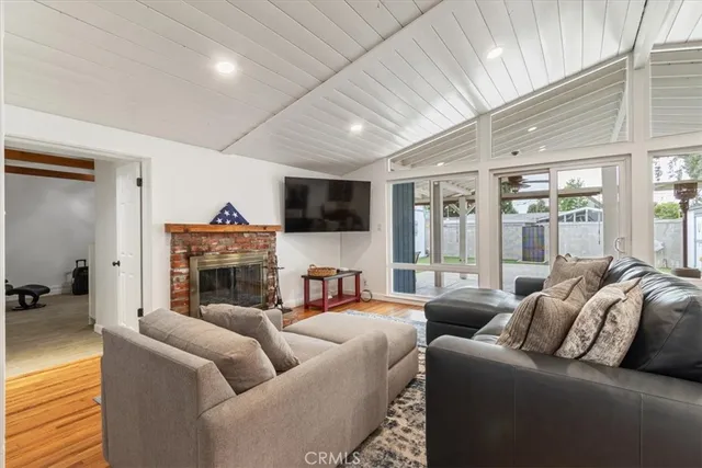 a living room with furniture cabinets and window