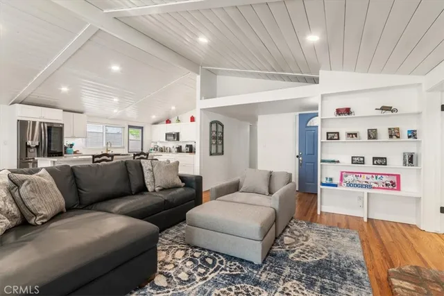 a kitchen with a sink a stove and cabinets