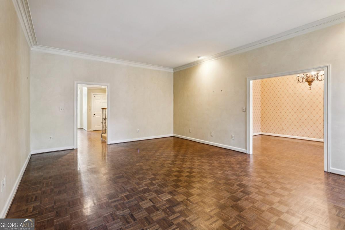 19 Mooregate Square Northwest Atlanta, GA 30327 - Photo 13 of 48 an empty room with wooden floor and windows
