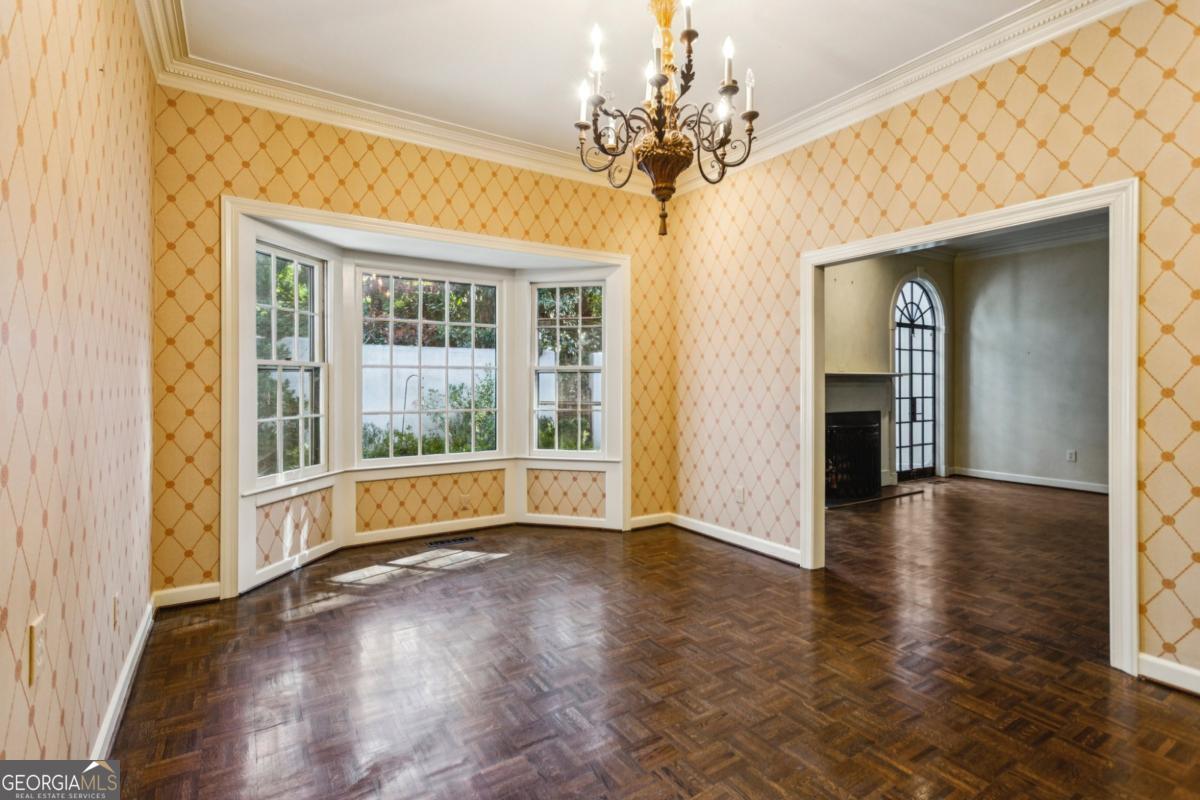 19 Mooregate Square Northwest Atlanta, GA 30327 - Photo 17 of 48 wooden floor in an empty room with a window