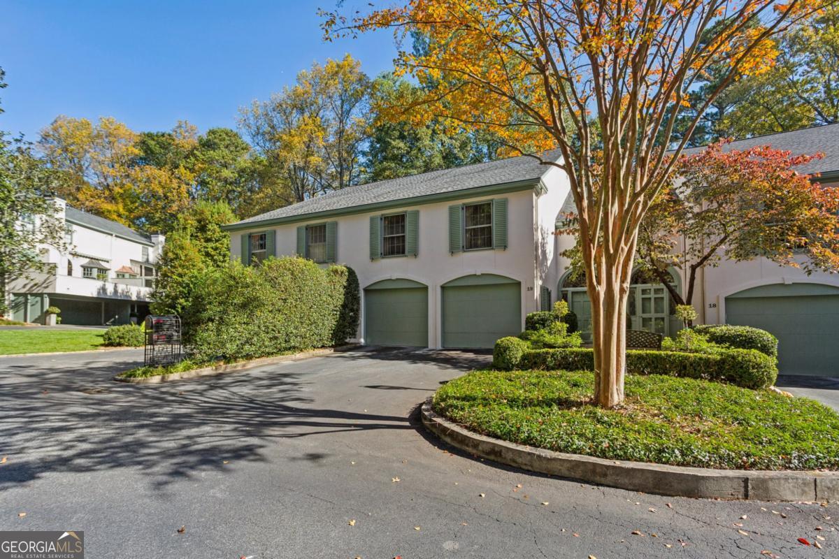 19 Mooregate Square Northwest Atlanta, GA 30327 - Photo 2 of 48 a front view of a house with garden