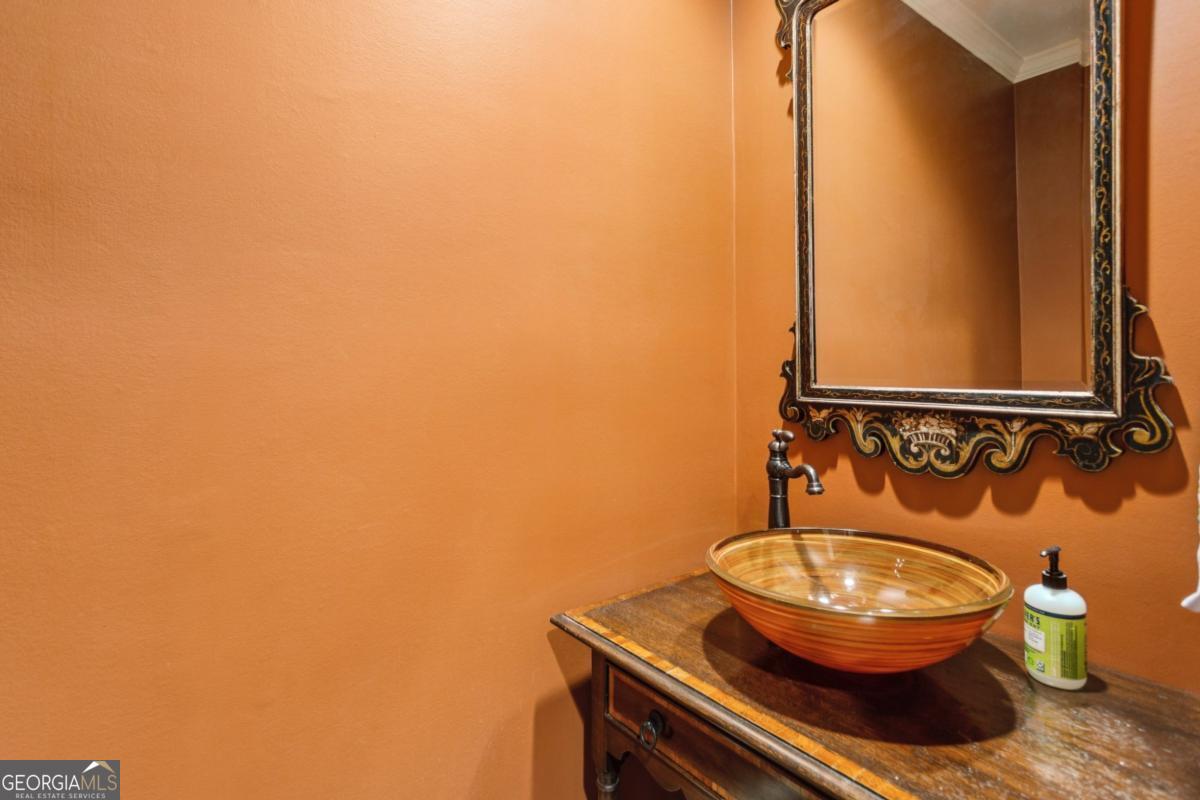 19 Mooregate Square Northwest Atlanta, GA 30327 - Photo 26 of 48 a bathroom with a toilet and a mirror