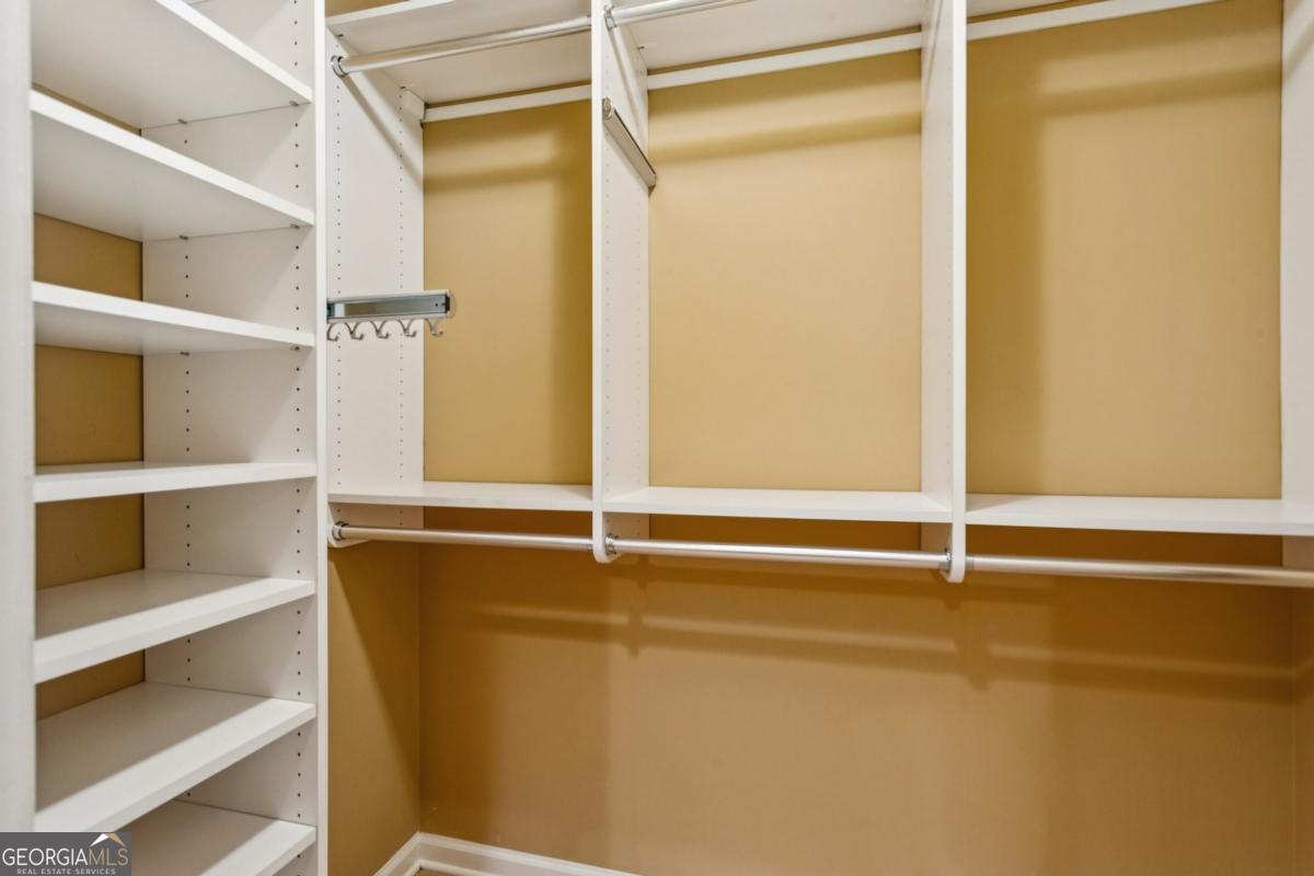 19 Mooregate Square Northwest Atlanta, GA 30327 - Photo 29 of 48 a view of walk in closet with empty racks