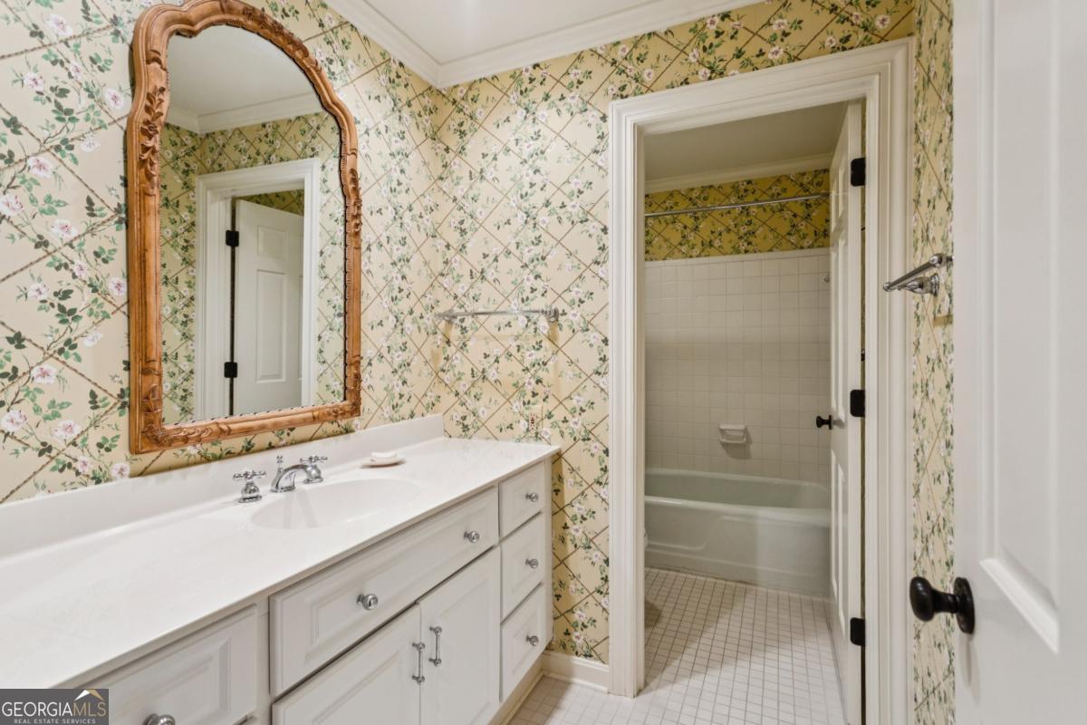 19 Mooregate Square Northwest Atlanta, GA 30327 - Photo 38 of 48 a bathroom with a sink a vanity and a mirror