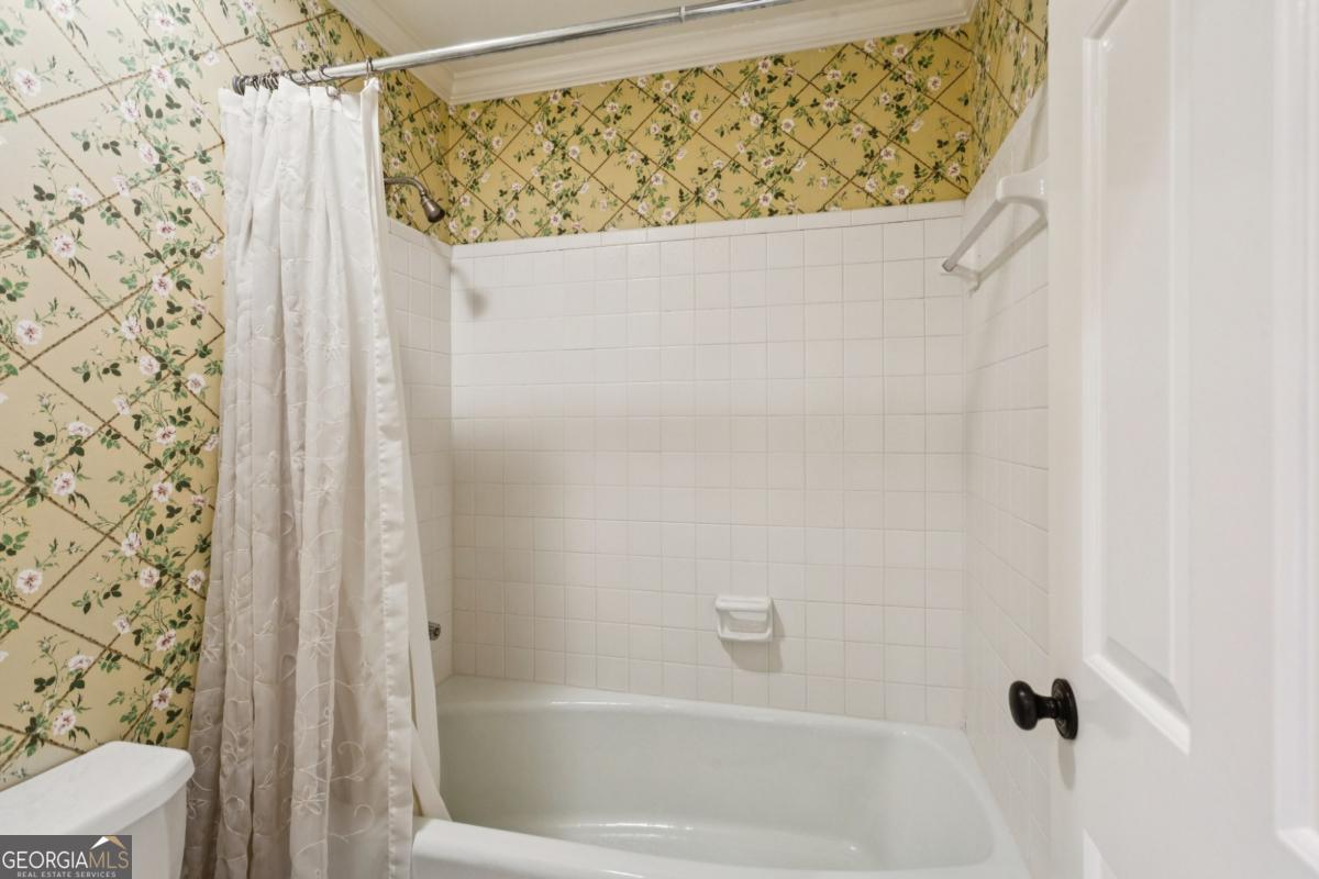 19 Mooregate Square Northwest Atlanta, GA 30327 - Photo 39 of 48 a bathroom with a shower curtain