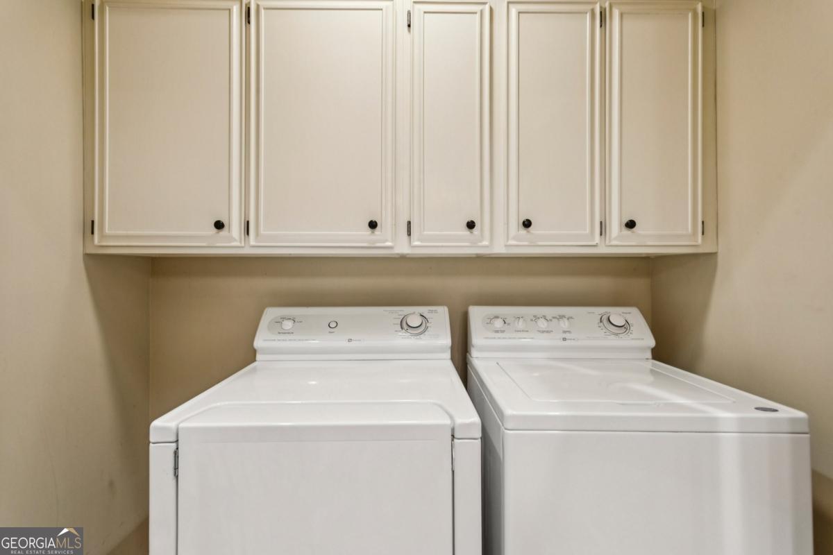 19 Mooregate Square Northwest Atlanta, GA 30327 - Photo 40 of 48 a utility room with dryer and washer