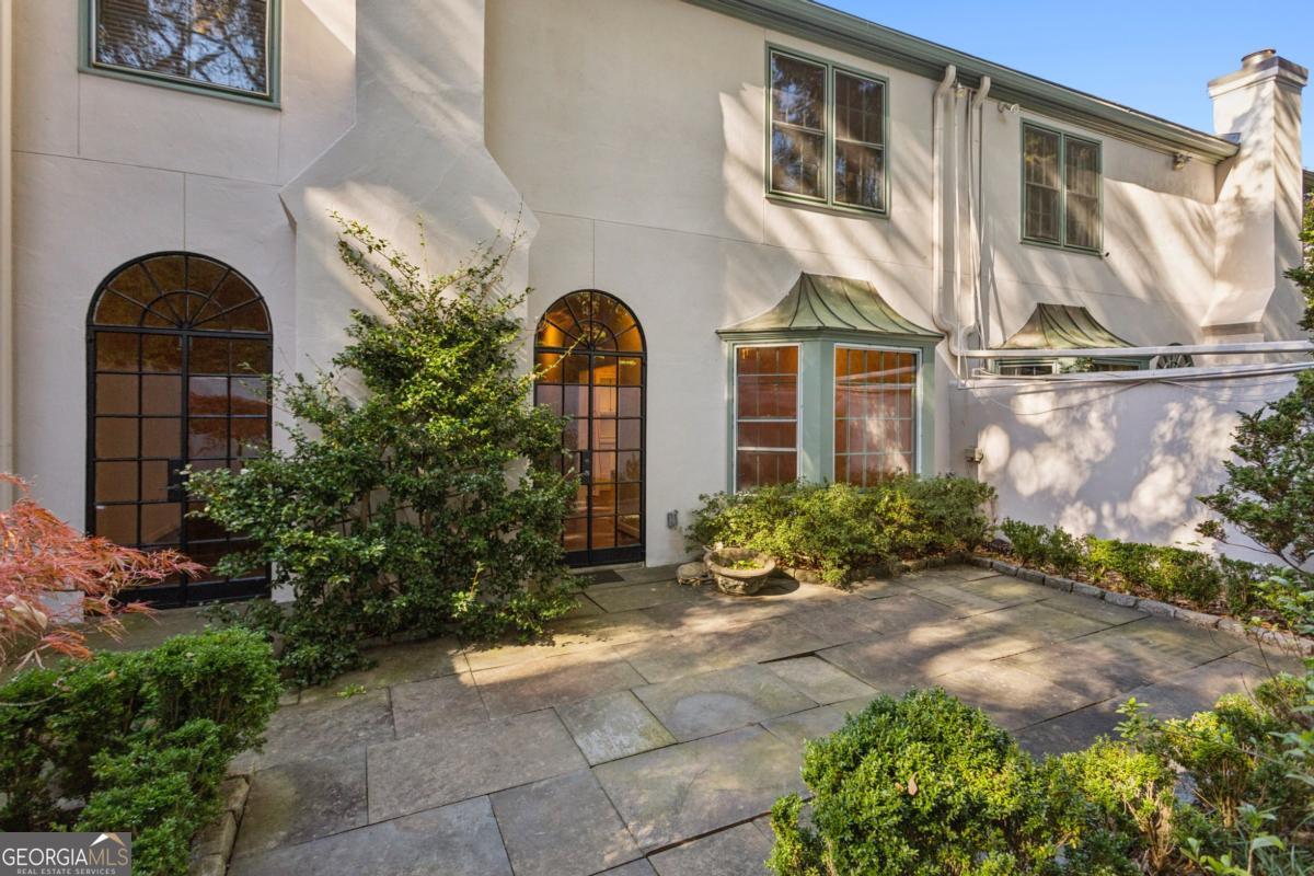 19 Mooregate Square Northwest Atlanta, GA 30327 - Photo 44 of 48 a front view of a house with garden