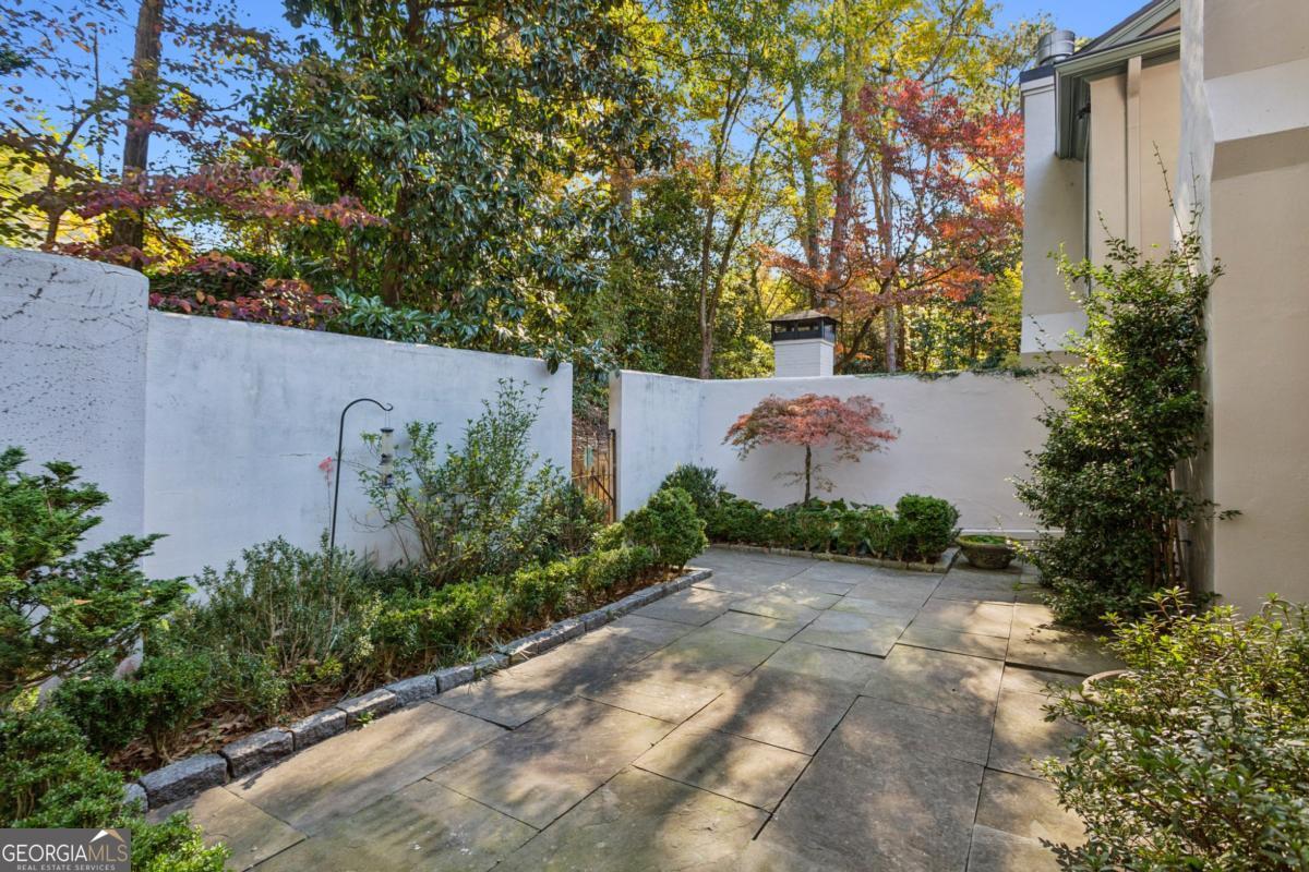 19 Mooregate Square Northwest Atlanta, GA 30327 - Photo 45 of 48 a backyard of a house with lots of green space