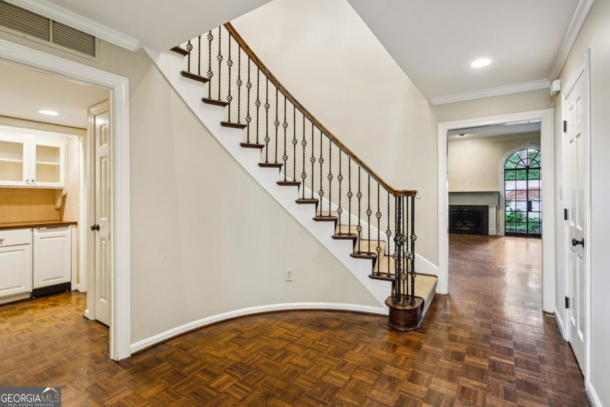 19 Mooregate Square Northwest Atlanta, GA 30327 - Photo 9 of 48 a view of staircase with wooden floor and a rug