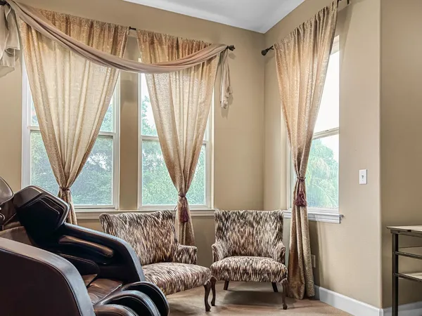 a living room with a couch and a table next to a window