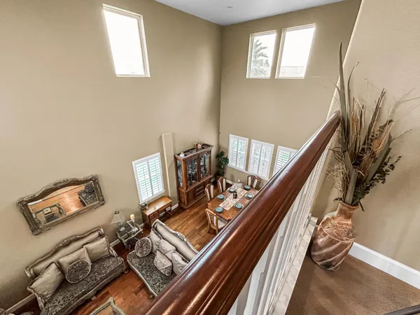 a view of a living room with wooden floor